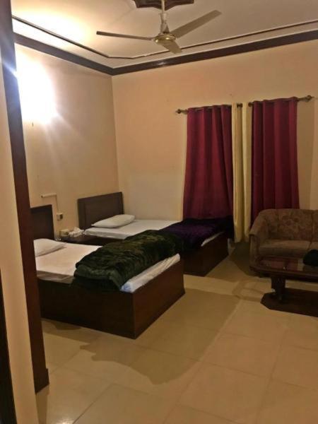 Hotel Babar House Faisalabad Esterno foto